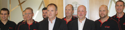 Dave Wibberley (front left) with Hartmut Puetz at the press conference. Adroit team members in background